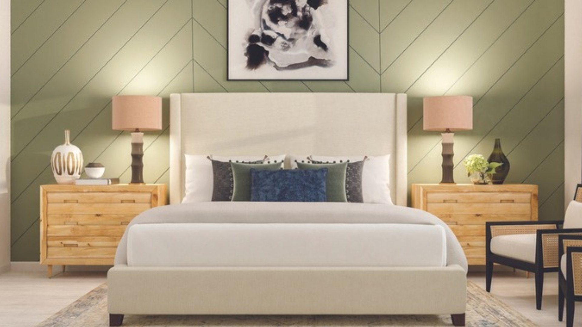 Sage green chevron trim accent wall behind an upholstered bed in a Venice, FL bedroom